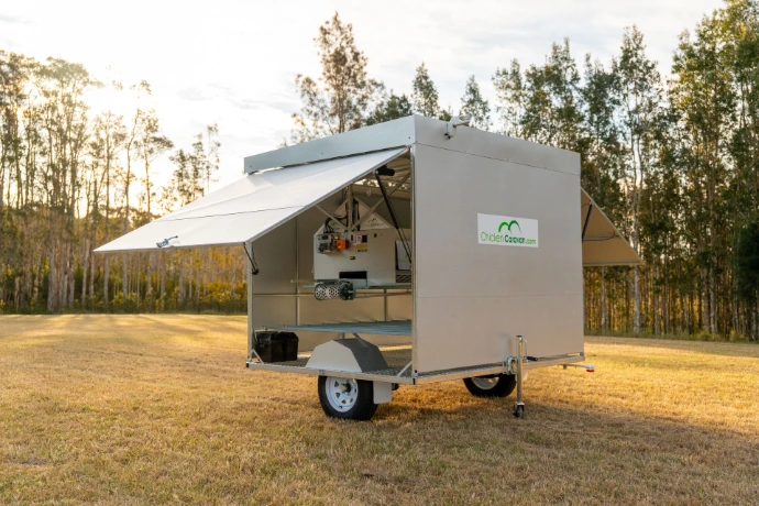Chicken Caravan 130 with the automatic doors open